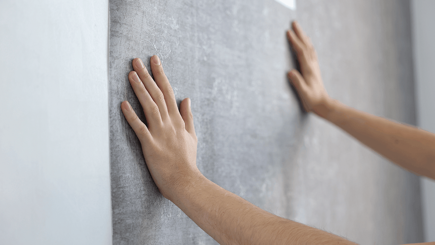 Decorator installing wallpaper